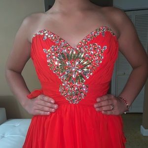 Red strapless high low gown